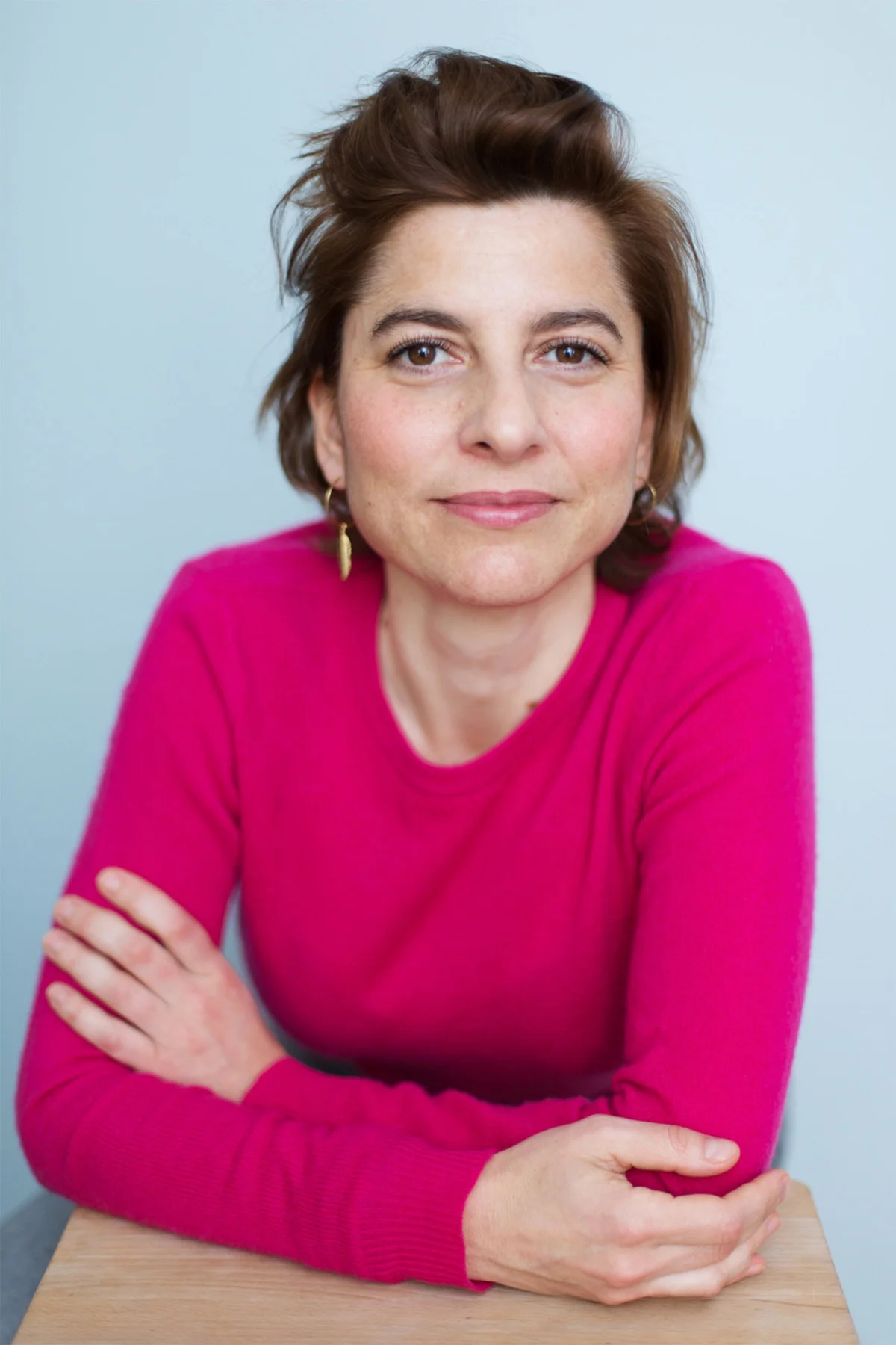 Personality portrait of a landscape designer in a pink jumper
